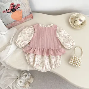 Detail of floral baby bodysuit and ruffled knit vest set in a French vintage style