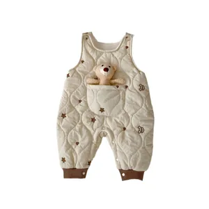Thick quilted baby romper in beige with brown embroidery and a plush bear toy in front