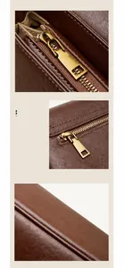 Détail de la fermeture éclair dorée et finition des bords huilés du sac en cuir