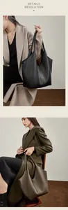 Nahaufnahme der hochwertigen Lychee-Lederstruktur an großen Shopper-Taschen