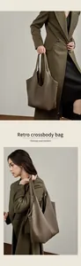 Detailansicht der großen Leder-Tragetasche mit reicher Litschi-Körnung und Retro-Stil
