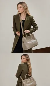 Detalle de bolso tote grande de cuero caqui con asas y correa de hombro ajustable