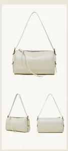 Vues détaillées du sac tonneau en cuir blanc crème montrant l'avant le côté et l'arrière