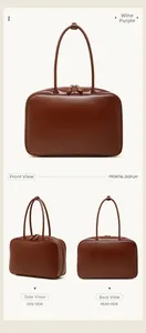 Three-way view of a burgundy leather bowling bag with double zipper and slim handles