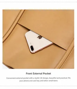 Detailed view of genuine leather tote with functional front pocket and precise stitching