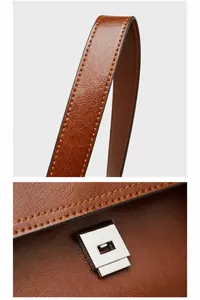 Detail of oil wax leather bag featuring silver press buckle and reinforced shoulder strap
