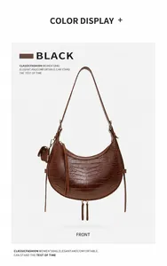 Detailed front view of brown croc-effect crescent bag with tassel and coin purse