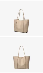 Macro detail of high-quality beige leather texture and fine stitching on large tote bag