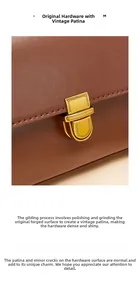 Macro detail of the vintage gold hardware and textured brown leather on a baguette bag