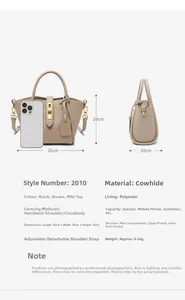 Detail view of milk tea genuine leather bucket bag with adjustable straps and phone size scale