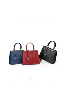 Detailed comparison of three large leather handbags in blue, burgundy, and black finishes