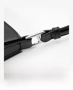 Close-up of the silver H-shaped buckle and textured black leather strap detail