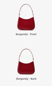 Front and back views of wine red leather baguette bag showing matte finish and gold text
