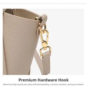 Detail of zinc alloy gold rotating hook with electroplated finish on leather bucket bag