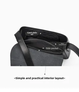 Detail view of leather bag interior showing three card slots, a main pocket and side pouch