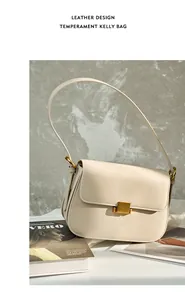 Close-up of cream leather bag featuring a polished gold rectangular clasp and slim strap