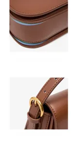 Detailed macro view of brown leather bag multi-layered base and metal buckle strap