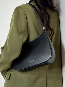 Minimalist black crescent leather underarm bag with gold fashion lettering for women