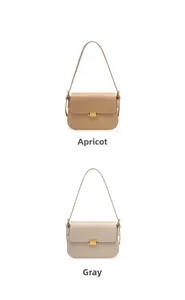 Detail view of leather shoulder bags in apricot and grey with gold square buckles