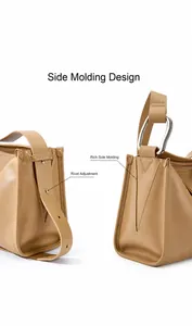 Dettaglio borsa in pelle kaki con fibbie metalliche argentate e rivetti regolabili laterali