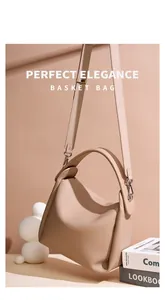 Detail of beige lychee grain leather handbag with silver hardware and top handle