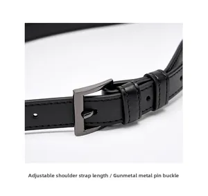 Detail of adjustable black leather strap with gunmetal buckle and premium stitching