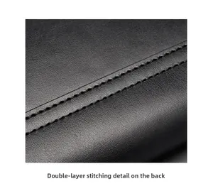 Close-up of double-layer stitching and lychee grain texture on black leather bag