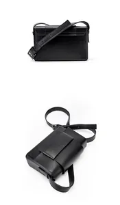 Detailed view of black matte leather crossbody bag with gunmetal buckle and adjustable strap