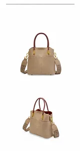 Dettaglio borsa a secchiello in pelle Elephant Grey con manico rosso e tracolla in tessuto