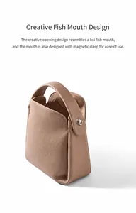 Detail view of the taupe pebbled leather handbag featuring a creative magnetic closure