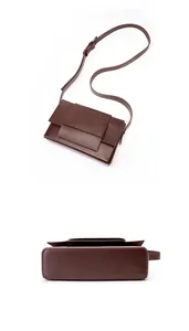 Detailed bottom view and smooth texture of dark brown leather crossbody bag