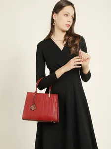 Fashionable red leather handbag for women featuring elegant wave pattern embossing