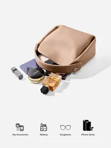 Leather handbag showing interior capacity for phone, cosmetics, and everyday essentials