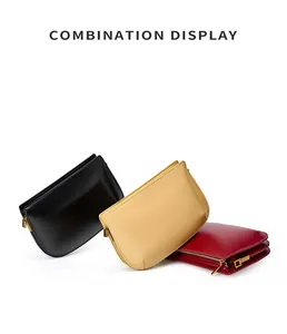 Detailed top view of minimalist leather clutches in black, yellow, and red with gold zippers