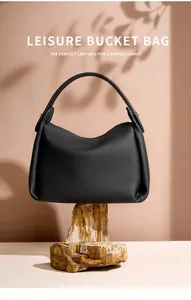 Detail of premium black pebble grain leather leisure bucket bag with minimalist handle