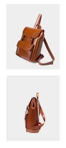 Detail view of vintage brown leather backpack with buckle straps and gusseted side design