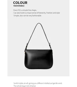 Detail of adjustable golden metal buckle on a premium black leather shoulder bag