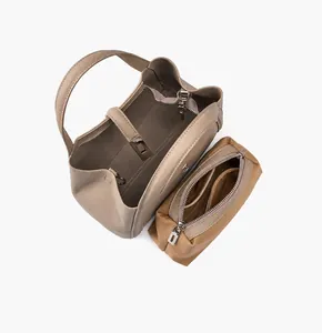 Internal view of the leather tote featuring a zipper pouch and inner pocket layout