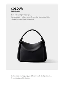 Macro detail of black litchi grain leather texture and folded side structure of the handbag