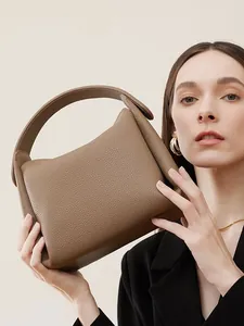 Vintage top grain leather shoulder bag in taupe with pebbled texture and hand strap