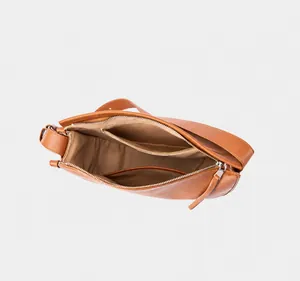 Interior view of leather tote showing spacious main compartment and zipper pockets