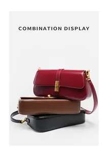 Vertical display of leather baguette bags in wine red, brown and black with gold buckles