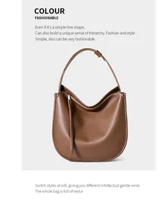 Detailed view of brown leather shoulder bag texture with soft natural grain and minimalist design
