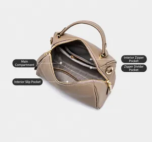 Interior layout of leather Boston bag showing multiple compartments and zipper pockets