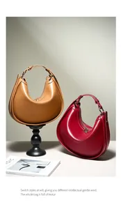 Detailed comparison of camel and deep red crescent hobo bags with smooth leather finish