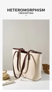 Détail du sac cabas en cuir grainé crème avec anses marron et intérieur spacieux