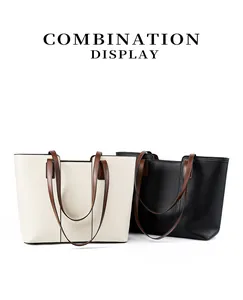 Détails des sacs cabas en cuir grainé beige et noir avec des bandoulières marron chic