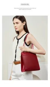 Sac fourre-tout en cuir rouge porté à l'épaule pour un style minimaliste et décontracté