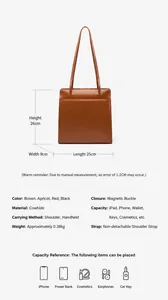Detail showing genuine cowhide leather texture and precise magnetic closure of the tote bag