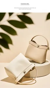 Close-up of litchi grain leather texture and metal swivel lock on luxury bucket bags